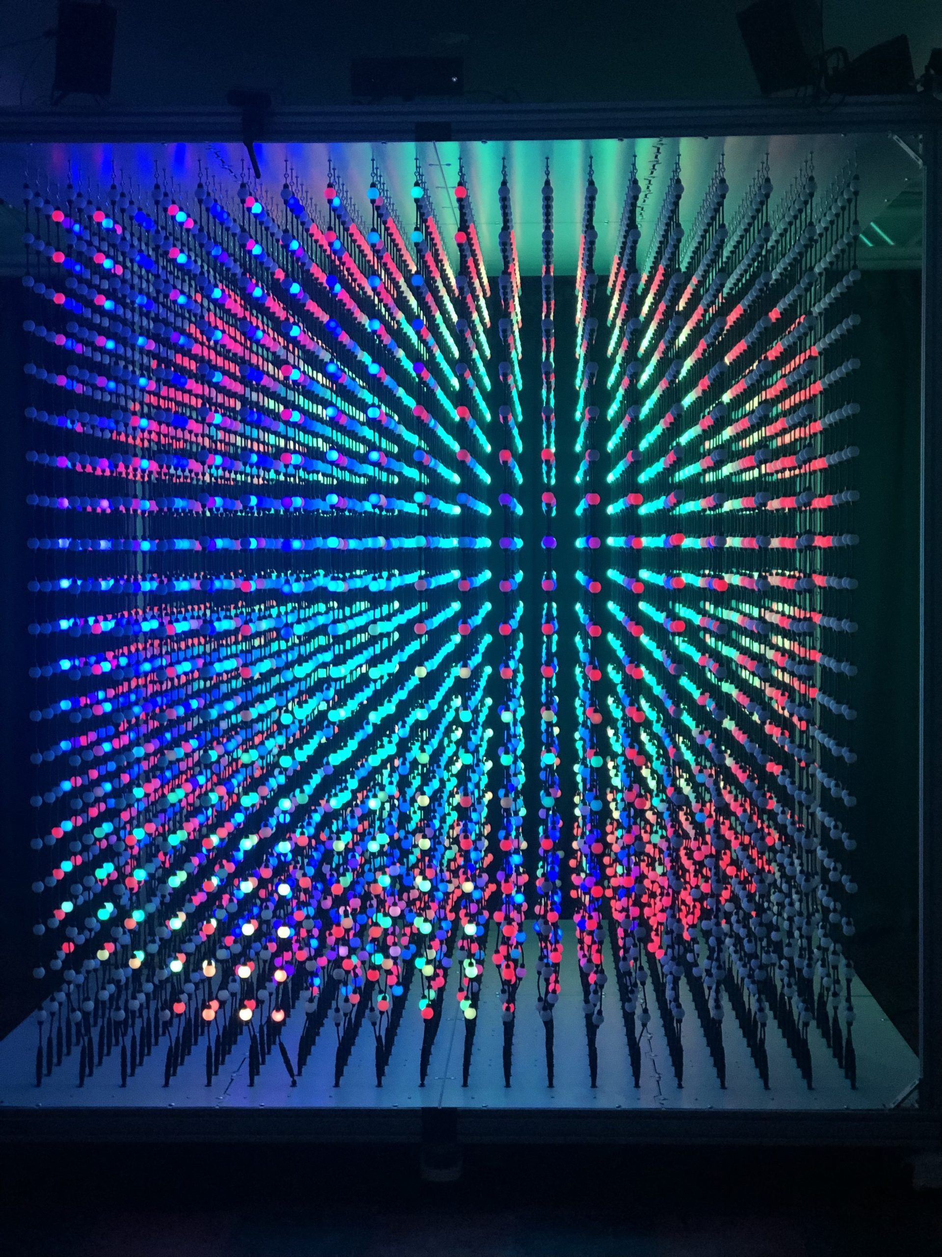 close up of the Dotbox. foreground bulbs are lit with pinks and purples. Background bulbs are lit with greens and blues.